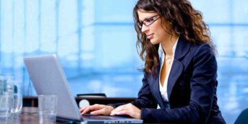 Businesswoman using laptop computer at office.  Click here for other business images: