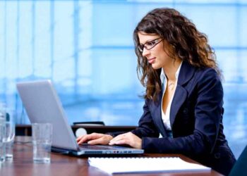 Businesswoman using laptop computer at office.  Click here for other business images: